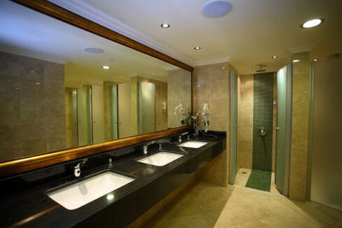 multi sink restroom area with black sinks