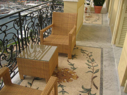 mosaic tile flooring in floral pattern with table and chairs