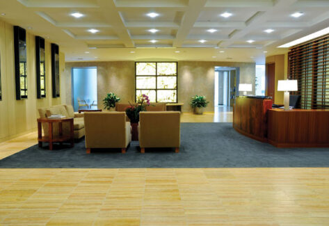 lobby area with chairs and beige flooring
