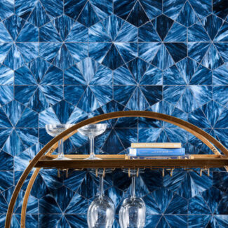 blue and white star style hexagonal tiles with wine rack and books