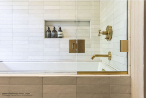 Bedrosian white tile tub with gold faucet
