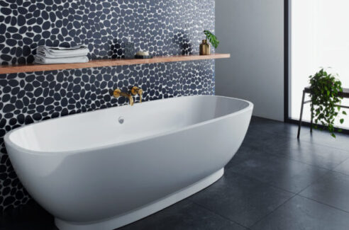 Island Stone Midnight Palms bathroom tile with white tub