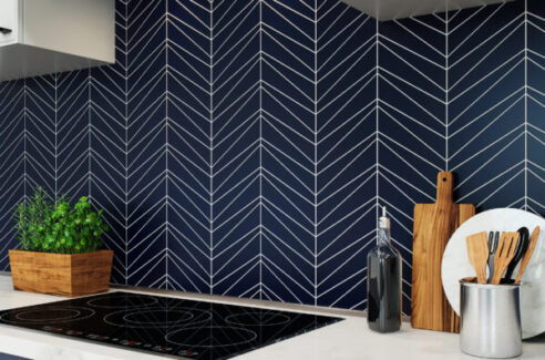 kitchen backsplash in blue and white Palms Midnight design over black stovetop