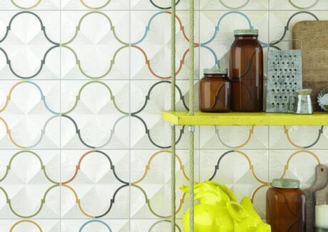 white tiles with colorful line designs and shelf with kitchen items