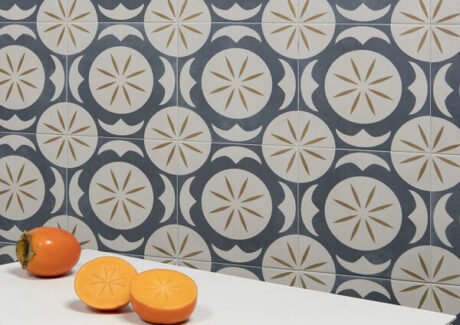 blue and white tiles with round white circles with star design in the center