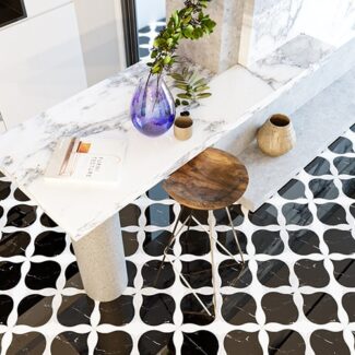 Marblesystems black and white flower patterned tile with white marble table and stool
