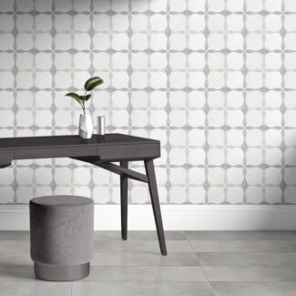 Marblesystems white square tiles with gray borders behind black table with plant and stool