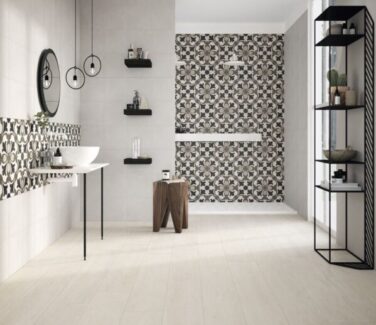 Panam brown, black and white patterned tile on bathroom wall with white flooring