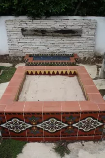 stone tile sand pit with colorful designs