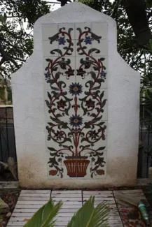 floral tile backdrop on concrete pillar in backyard