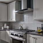 kitchen backsplash with white rectangular tiles over stove top with white cabinets