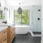 Bedrosian gray tile flooring with white tub and shower