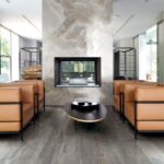 Elysium fireplace in decowood pearl in living room with brown chairs