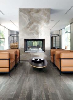 Elysium fireplace in decowood pearl in living room with brown chairs