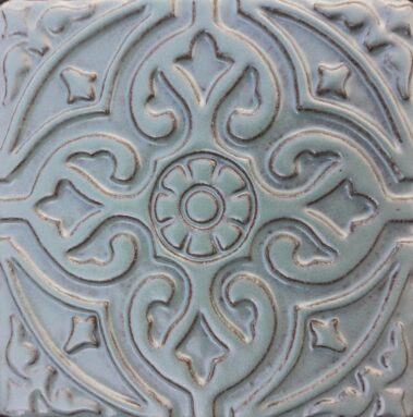 light blue ceramic tile with florentine design